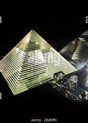 precious diamond pyramid photographed on a dark background, visual design Stock Photo