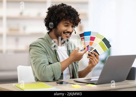 Indian guy designer working from home while pandemic, copy space Stock Photo