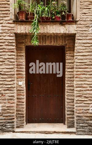 Detail of wooden ancient door with old iron rivets Stock Photo