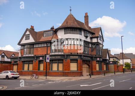 London- April 2022: A vacant pub with boarded up windows in Ealing, West London Stock Photo