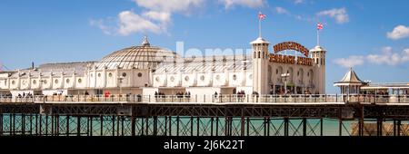 Brighton- April 2022: Brighton Pier-  Victorian structure and amusement park in the popular and fashionable coastal town in South England Stock Photo