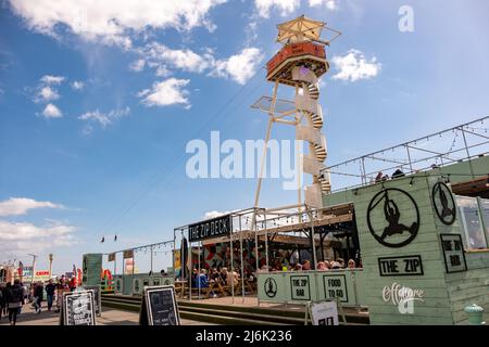 Brighton- April 2022: Brighton Beach Front-  Victorian structure and amusement park in the popular and fashionable coastal town in South England Stock Photo