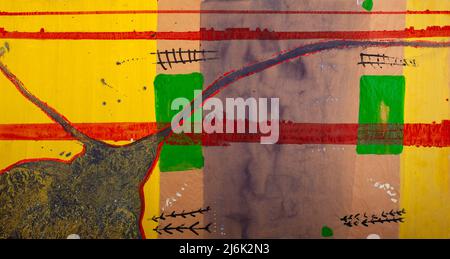 Abstract painting is realized with watercolors. The brushes strokes and the dripping technique is made with yellow, green, red and gray colors Stock Photo