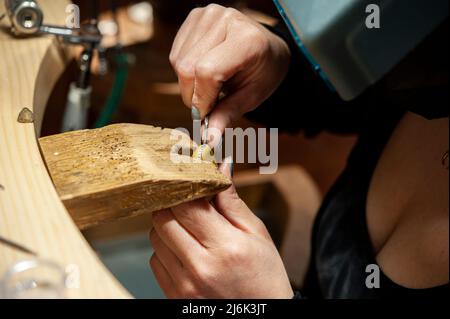 Goldsmith at work in his workshop. Stock Photo