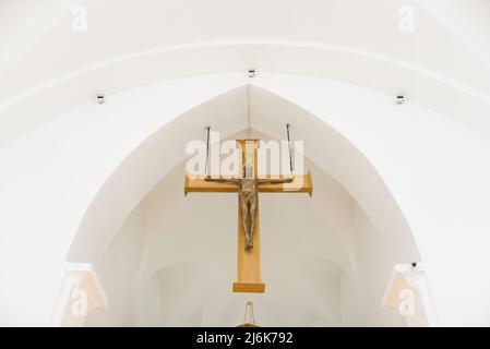 Minsk, Belarus. August 2021. A cross in the interior of the Zolotogorsky Church of the Most Holy Trinity of St. Roch Stock Photo