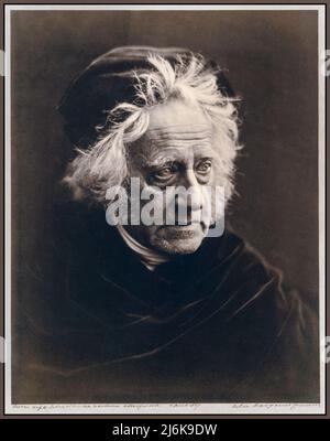 John Herschel (1815-1879), photographed by renowned photographer Julia Margaret Cameron in April 1867.  John Herschel was an English mathematician, astronomer, chemist, inventor, and experimental photographer. He named seven moons of Saturn and four moons of Uranus, invented the cyanotype and actinometer, and wrote extensively on topics including meteorology, physical geography and the telescope. Stock Photo