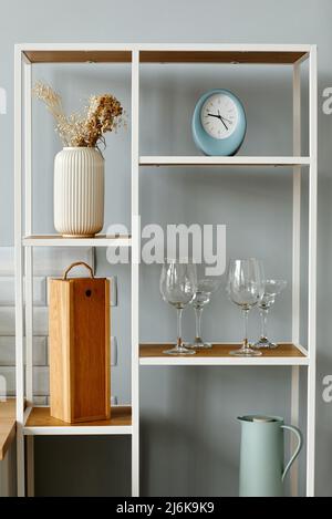 Vertical background image of minimal open shelf with decor elements in kitchen Stock Photo