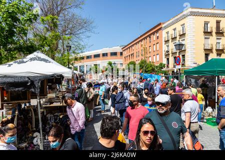 A typical crowded and vibrant Sunday view in Madrid of the open air flea market El Rastro. It is locatedbetween Calle Embajadores and Toledo gate Stock Photo