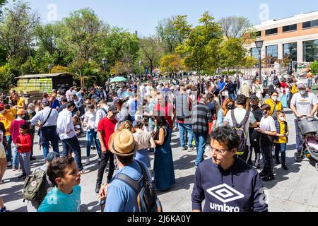 A typical crowded and vibrant Sunday view in Madrid of the open air flea market El Rastro. It is locatedbetween Calle Embajadores and Toledo gate Stock Photo