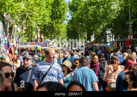 A typical crowded and vibrant Sunday view in Madrid of the open air flea market El Rastro. It is locatedbetween Calle Embajadores and Toledo gate Stock Photo