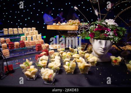 fruit slicing in plastic cups on the catering. Stock Photo