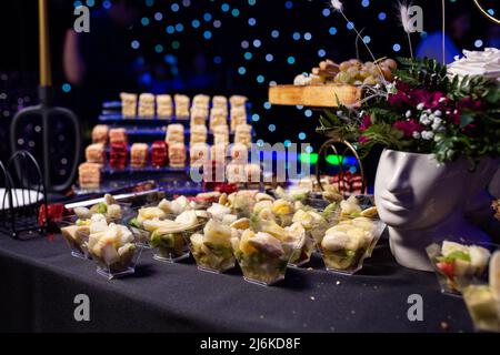 fruit slicing in plastic cups on the catering. Stock Photo