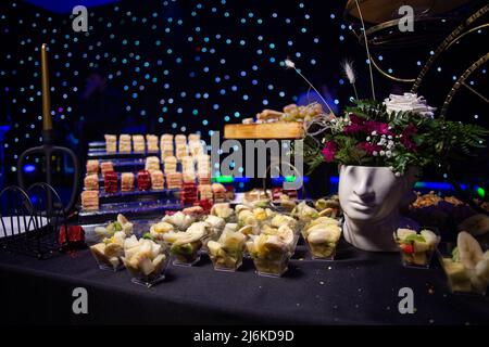 fruit slicing in plastic cups on the catering. Stock Photo