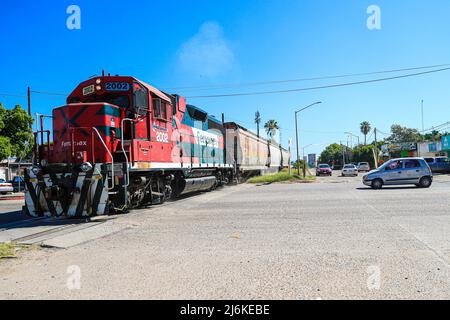 Feromex company train passing through Navojoa, Sonora Mexico. Mexican transport, Mexican railways, the largest railway network in Mexico with 11,000 km of track, covering the main industrial and consumer areas of the country. Stock Photo