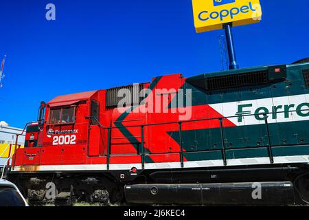 Feromex company train passing through Navojoa, Sonora Mexico. Mexican transport, Mexican railways, the largest railway network in Mexico with 11,000 km of track, covering the main industrial and consumer areas of the country. Stock Photo