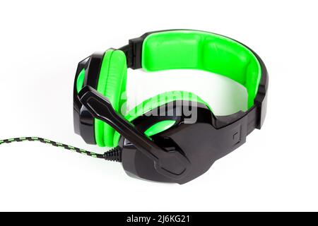 Simple bright light neon green wired gaming headphones with a microphone object isolated on white cut out, audio chatting communication, PC gamer comp Stock Photo