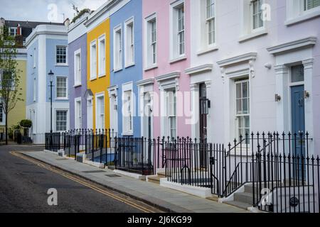 London -April 2022: Colourful street of upmarket townhouses in Notting Hill area of West London Stock Photo