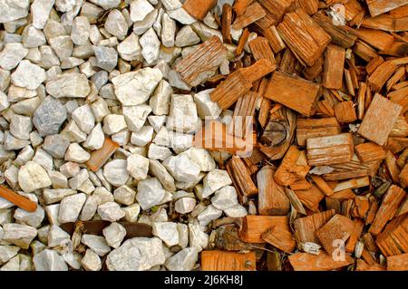 Texture of white stones and small pieces of colored wood, flat layout, wallpaper for various projects Stock Photo