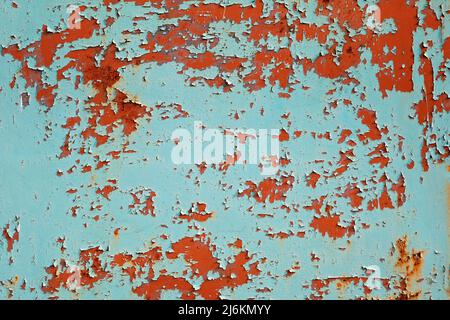 Metal sheet rusty faded texture. Peeling turquoise paint on a concrete wall. Steel plate background. Stock Photo
