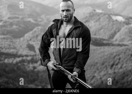 Young caucasian european hunter. American hunting rifles. Hunting without  borders. Hunter with shotgun gun on hunt. Portrait of handsome Hunter in  bro Stock Photo - Alamy