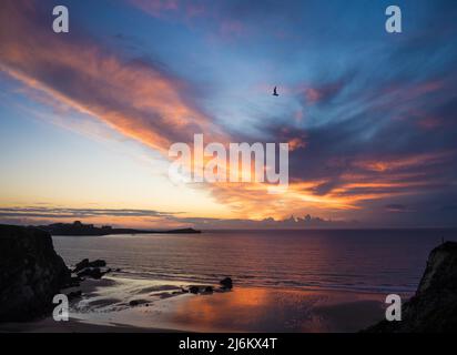 Dramatic sunset over Lusty Glaze beach in Cornwall, England Stock Photo