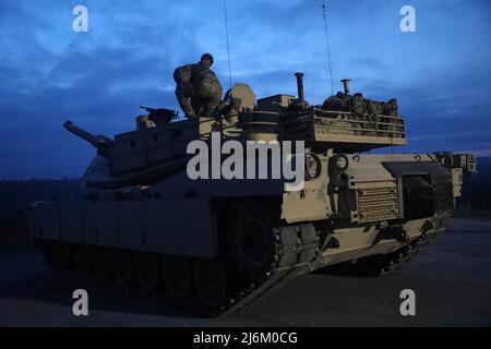 The M1A2 SEP V2 Main Battle Tank crew assigned to 2nd Battalion, 69th Armored Regiment, 2nd Armored Brigade Combat Team, 3rd Infantry Division, engages in boresight operation during preliminaries at Fort Benning, Georgia, May 2, 2022. The Sullivan Cup highlights and validates training education required to employ the latest advancements of Armor modernization in support of Armored Brigade Combat Teams and Cavalry formations. (U.S. Army Photo by Pfc. Duke Edwards, 50th Public Affairs Detachment) Stock Photo