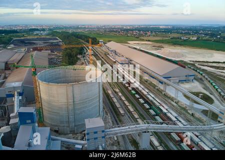 Aerial view of cement factory under construction with high concrete ...