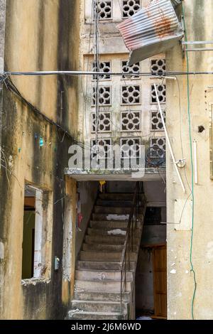 Close-up of residential building stairs in an abandoned old residential area Stock Photo