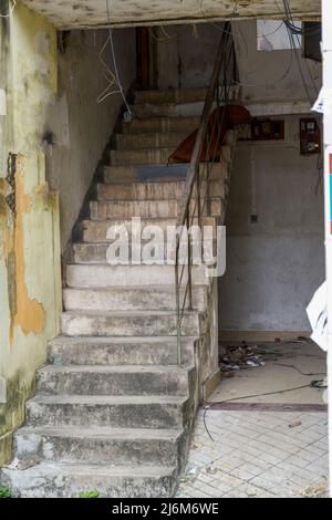 Close-up of residential building stairs in an abandoned old residential area Stock Photo