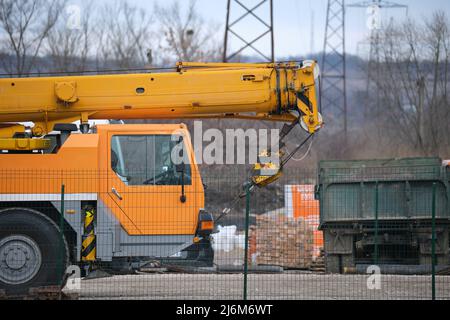 Heavy duty mobile lifting crane at construction site Stock Photo