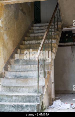Close-up of residential building stairs in an abandoned old residential area Stock Photo