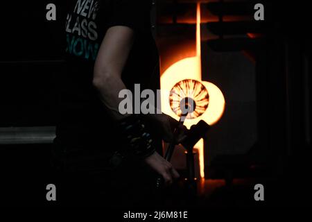 Glass blowing - a glass kiln furnace - glory hole - used in making glass art at the Corning Museum of Glass Stock Photo