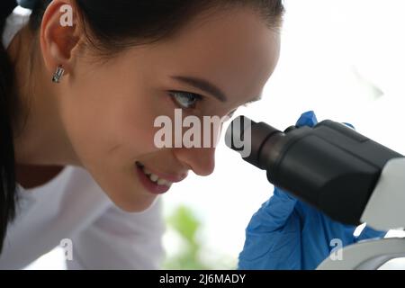 Pharmacy scientist working with professional microscope in technology lab Stock Photo