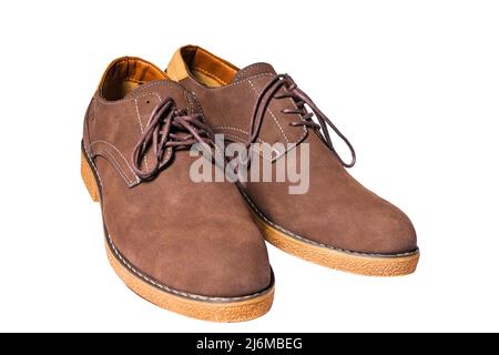 Casual brown shoes with laces on a white background. Stock Photo