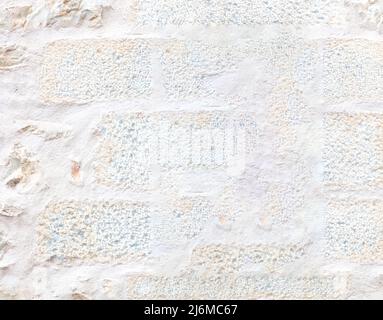 White color painted stone blocks wall texture background. Aged industrial construction, front close up view Stock Photo