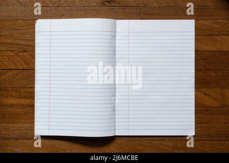 Ruled paper notebook on wooden table Stock Photo