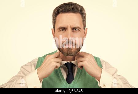 mature guy in formalweargetting dressed isolated on white background, male fashion Stock Photo