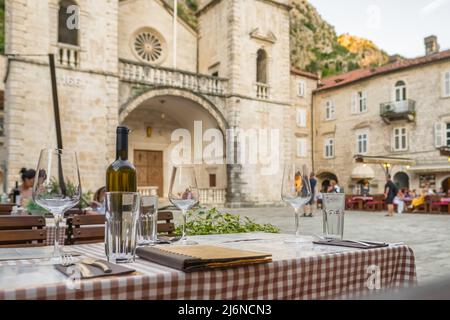 Outdoor street cafe in Kotor old town square in Montenegro Stock Photo