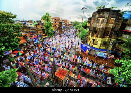 Kolkata, India. 03rd May, 2022. Muslim devotees offer Eid al-Fitr prayers under the rain marking the end of the holy fasting month of Ramadan on an open street of Kolkata. Eid al-Fitr is a Muslim festival of happiness celebrated all over the world marking the end of the holy month of Ramadan. Credit: SOPA Images Limited/Alamy Live News Stock Photo