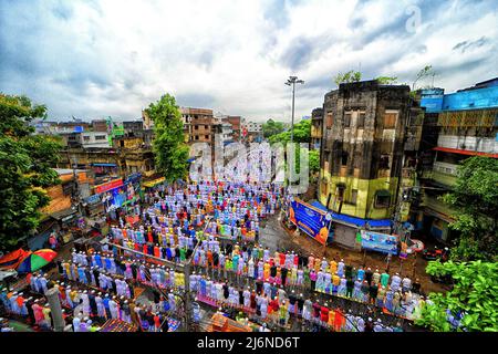 Kolkata, India. 03rd May, 2022. Muslim devotees offer Eid al-Fitr prayers under the rain marking the end of the holy fasting month of Ramadan on an open street of Kolkata. Eid al-Fitr is a Muslim festival of happiness celebrated all over the world marking the end of the holy month of Ramadan. Credit: SOPA Images Limited/Alamy Live News Stock Photo