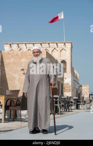 Doha ,Qatar - February 01,2020 : New souk Al Wakrah waterfront promenade with his traditional houses and local people enjoying walking. Stock Photo