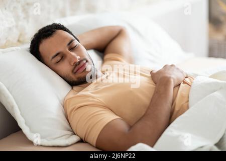 Middle Eastern Man Sleeping Lying On Pillow In Bed Indoor Stock Photo