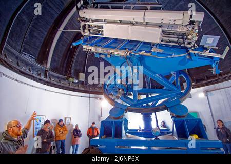 Visitors to the Pic du Midi Observatory near Bagneres de Bigorre, France, are given an explanation about the workings of the multiple Coronagraph. Stock Photo