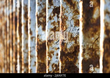 Rusty bridge railing texture background with cracked white paint Stock Photo