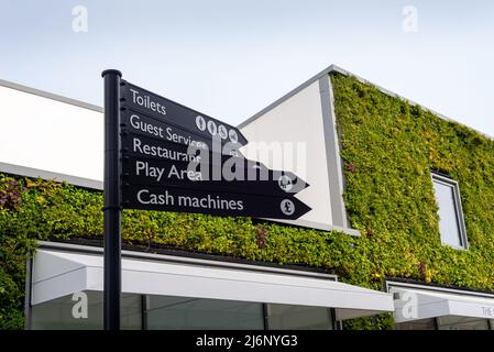 Wayfinder directional signage at Ashford Outlet Center, Kent, England, UK. Toilets, Restaurant etc. Stock Photo