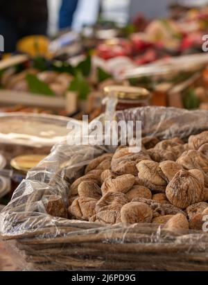 Lots of dried and dehydrated figs in the street market along with different nuts around Stock Photo