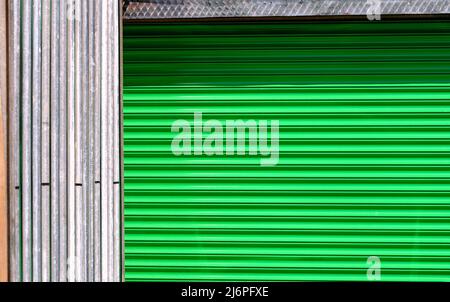 A bright green abstract pattern created by corrugated metal shuttering Stock Photo