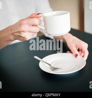 morning Cup of tea in the hands of a young woman Stock Photo