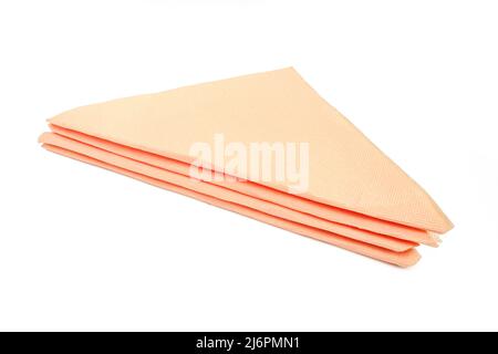Stack of triangle shape folded paper tissues isolated on white background. Soft kitchen napkins Stock Photo