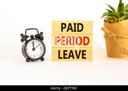 Paid period leave symbol. Concept words Paid period leave on wooden blocks. Black alarm clock. Beautiful white table white background. Business medica Stock Photo